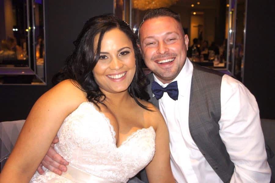 Newlyweds pose for a photo at the Brighton Savoy