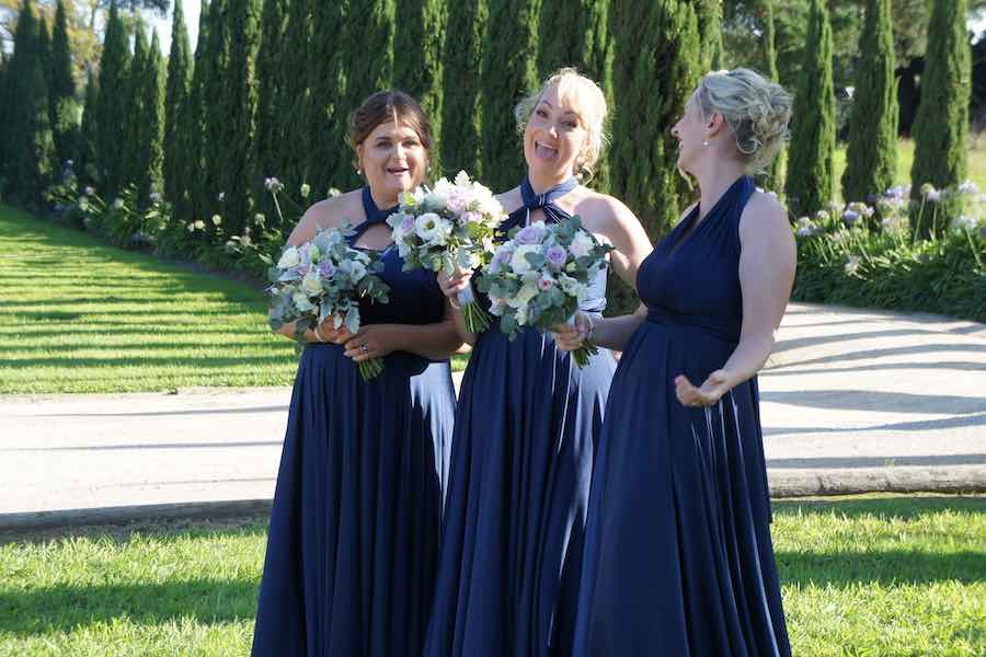 3 Bridesmaids at an outdoor wedding ceremony