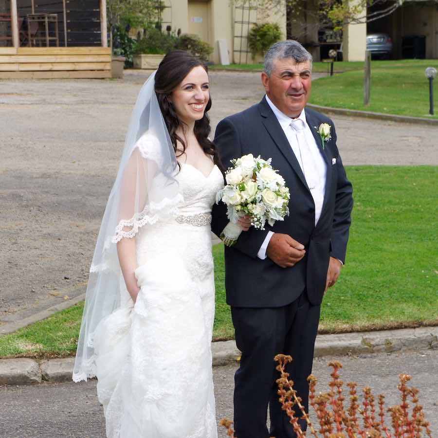 A father walking his daughter down the aisle